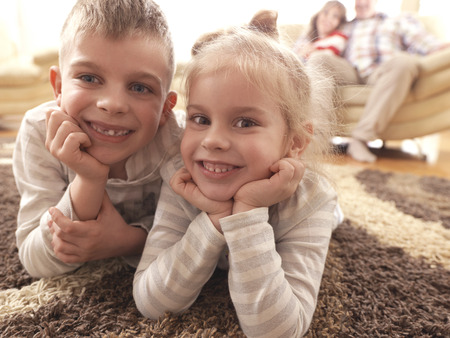 hapy young family have fun  with their children at modern living room home indoorsの写真素材