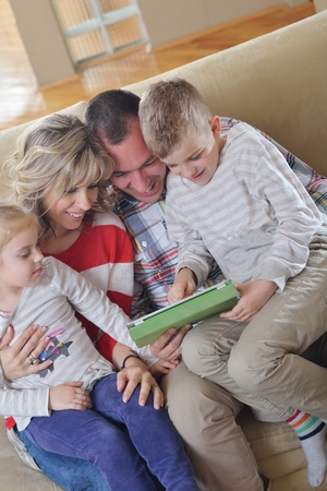 hapy young family have fun  with their children at modern living room home indoorsの写真素材