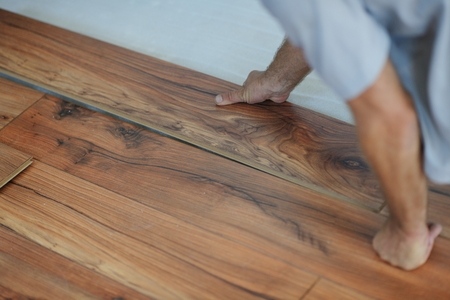 Installing laminate flooring in new home indoorの写真素材