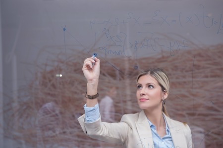 business woman with her staff, people group in background at modern bright office indoors