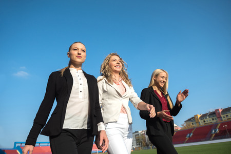 business people running together on racing trackの写真素材