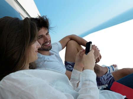 cheerful happy young couple making selfie together at home