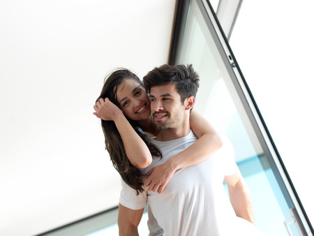 romantic happy young couple relax at modern home indoors and have funの写真素材