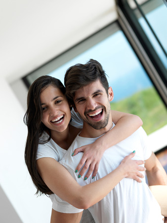 romantic happy young couple relax at modern home indoors and have funの写真素材
