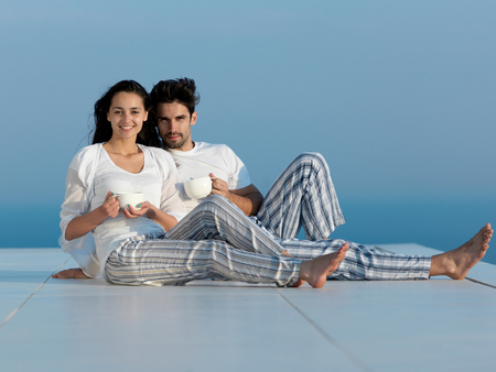 romantic happy young couple relax at modern home indoorsの写真素材