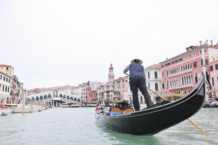 Venice - April 04: Gondoliero sailing in Venice, April 23, 2012, Venice, Italy. Grand Channel located in Venice - city on Italian islands and is famous for its gondola drivers coordinated by Guildのeditorial素材