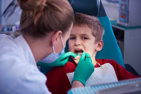 Young boy in a dental surgery teeth chechの写真素材