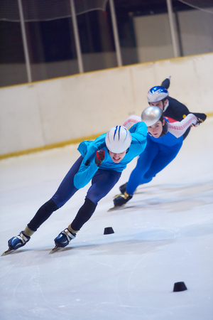 speed skating sport with young athletesの写真素材
