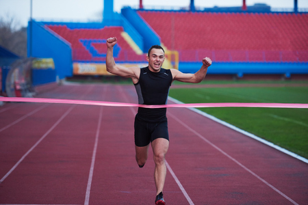 athletic runner finishing line trackの写真素材
