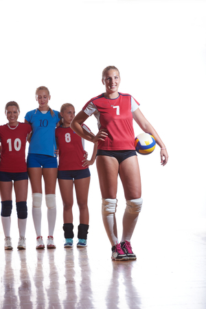 volleyball game sport with group of young beautiful  girls indoor in sport arena ball netの写真素材