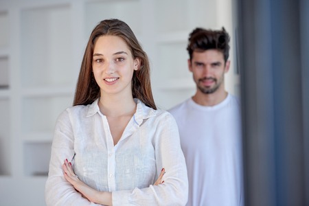 happy young romantic couple have fun relax smile at modern home outdoor terace balcony terace