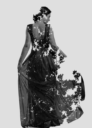 double exposure of woman in fashion dress with nature tree branches backgroundの写真素材