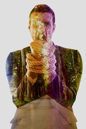 Business man pulling and bond tied with rope  concept  isolated on white background in studioの写真素材