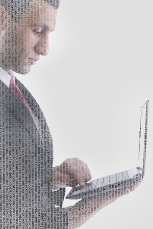 double exposure of business man working on laptop computer and abstract programming code numbersの写真素材