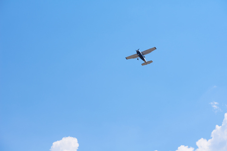 small retro airplane, clear blue sky in background