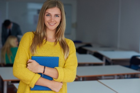 portrait of young female student at school classroomの写真素材