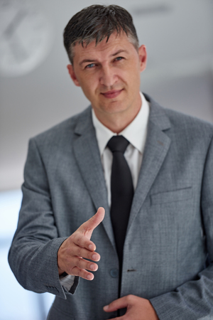 portrait of middle aged business man at modern office space indoorsの写真素材