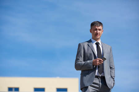 urban outdoor portrait of middle aged senior  business manの写真素材