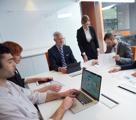 business people group with young adults and senior on meeting at modern bright office interior.の写真素材