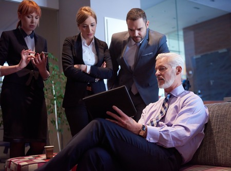 business people group with young adults and senior on meeting at modern bright office interior.の写真素材