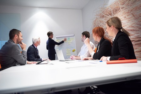 business people group with young adults and senior on meeting at modern bright office interior.の写真素材
