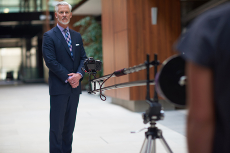 portrait of senior business man with grey beard and hair alone i modern office indoorsの写真素材
