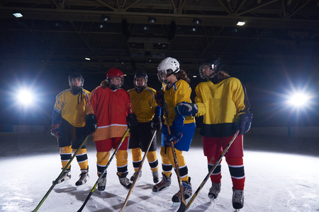 young teen girls ice hockey sport players portraitの写真素材