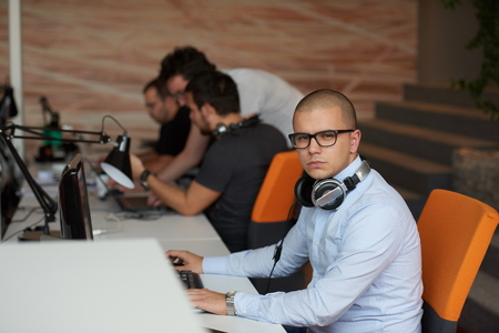 startup business, software developer working on computer at modern officeの写真素材