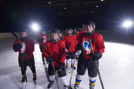 happy children group  ice hockey team  sport players portraitの写真素材