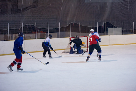 ice hockey sport players in action, business comptetition concpetの写真素材