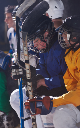 ice hockey players,  group of people,  team friends waiting and relaxing on bench to start  gameの写真素材