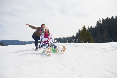 romantic winter  scene, happy young couple having fun on fresh show on winter vacatio, mountain nature landscapeの写真素材