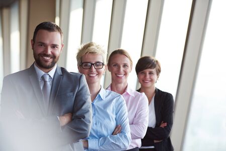 diverse business people group standing together as team  in modern bright office interiorの写真素材