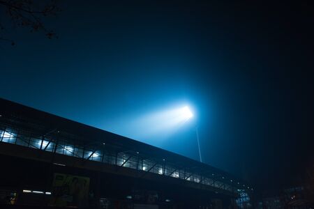 soccer stadium lights reflectors against black backgroundの写真素材