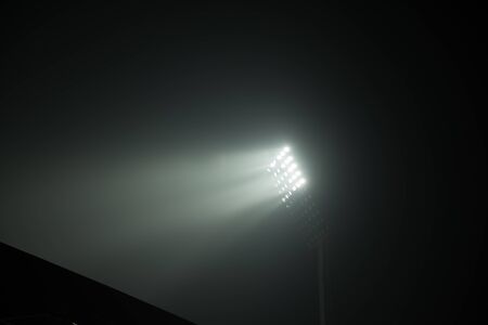 soccer stadium lights reflectors against black backgroundの写真素材