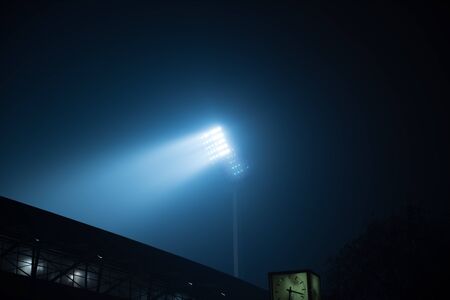 soccer stadium lights reflectors against black backgroundの写真素材