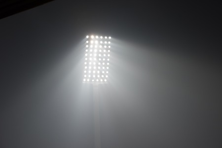 soccer stadium lights reflectors against black backgroundの写真素材
