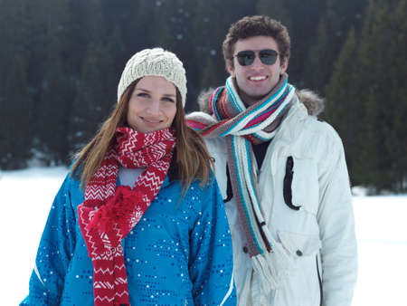 portrait of happy young romantic tourist  couple outdoor in nature at winter vacationの写真素材