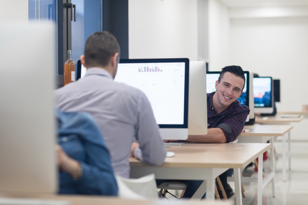 startup business, software developer working on desktop  computer at modern officeの写真素材