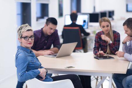 startup business team on meeting in modern bright office interior brainstorming, working on laptop...