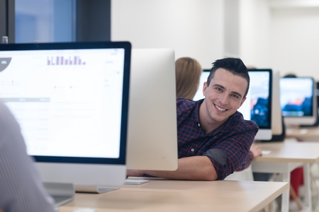 startup business, software developer working on desktop  computer at modern officeの写真素材