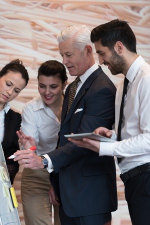 business people group brainstorming on meeting and businessman presenting ideas and projects on...