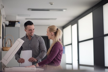 happy business people group at modern office copy  documents on machine