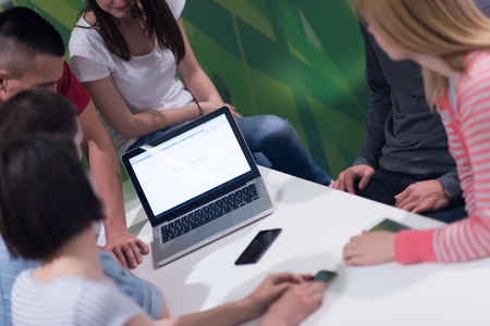 students group study together in school classroom and working together homework projectの写真素材