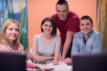 technology students group in computer lab school  classroom working onの写真素材