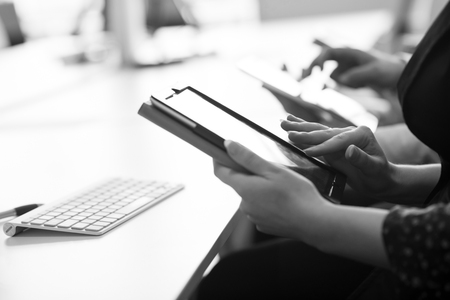 group of business people on meeting  using tablet computer in modern bright startup office interior,...