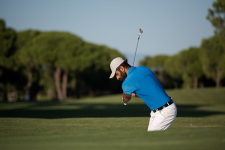 pro golf player shot ball from sand bunker at courseの写真素材