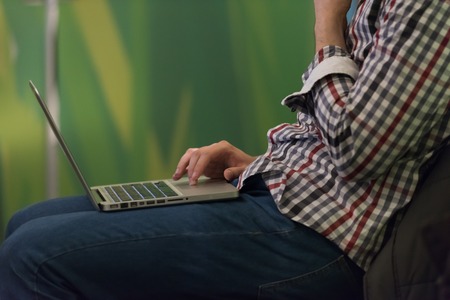 it student on workshop  listening  presentation and taking notes on laptop computerの写真素材