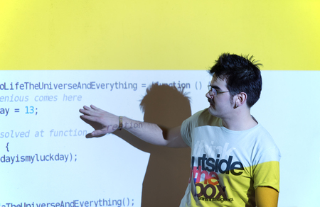 young computer technology students on  code programming class have presentationの写真素材