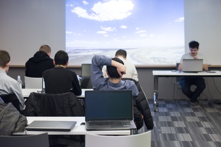 happy  man as audience sitting and relaxing on presentation while looking on beautiful sky with...
